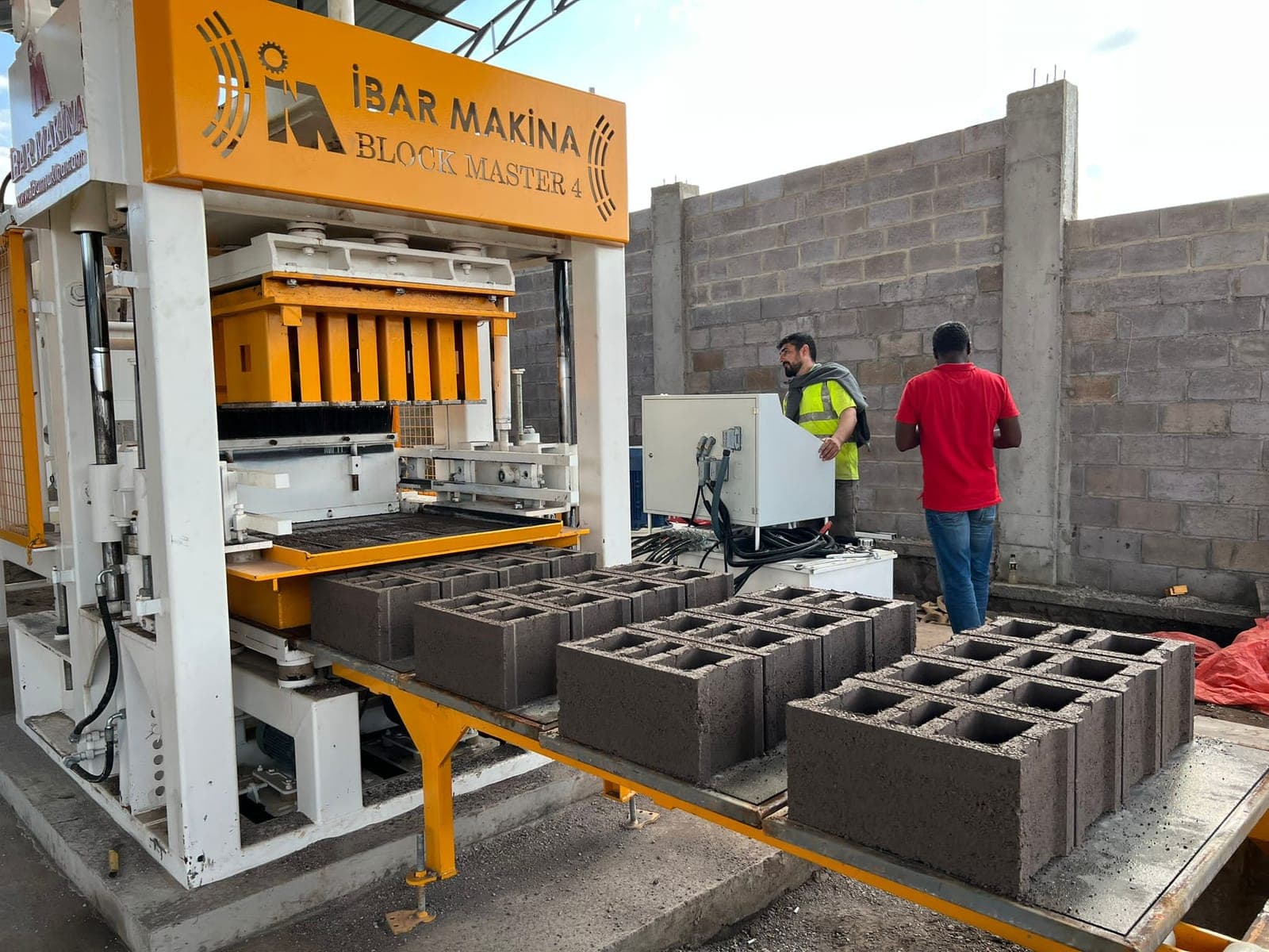BLOCKMASTER 4 block machine with fresh 20 cm hollow blocks on pallets during commissioning in Kolwezi, DR Congo
