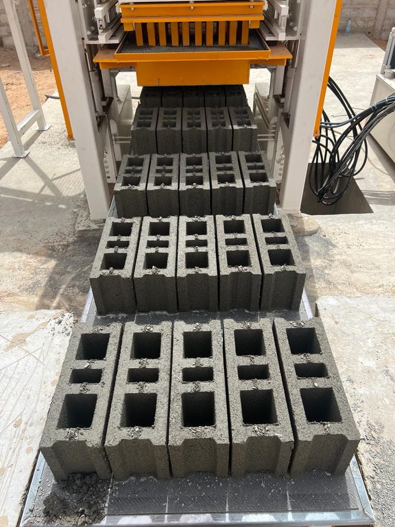 Pallets of five fresh hollow floor blocks (hourdis) leaving the BLOCKMASTER 4 mould, Senegal