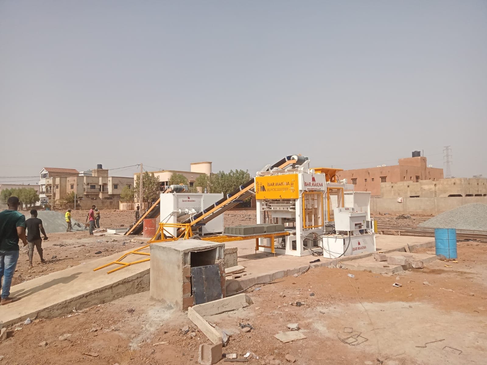 BLOCKMASTER 8 block making machine line with mixer and belt conveyors in Bamako, Mali