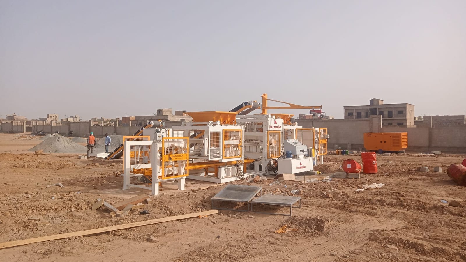 Block making line with mixer, belt conveyors and diesel generator on site